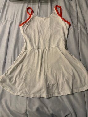 Free people movement women’s  Dress white with Orange Trim - size small